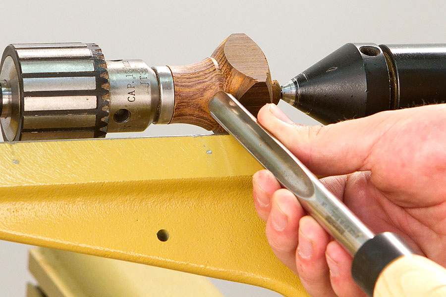 Turning the blank to shape with a spindle gouge.