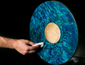 Applying finish to a dyed figured maple platter.