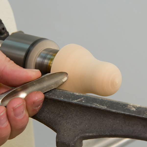 Turning the blank to shape with a spindle gouge.