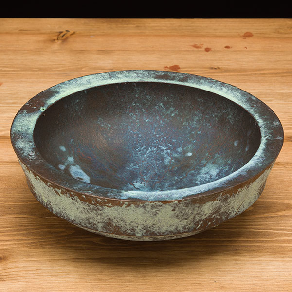 The finished bronze painted bowl with green patina.