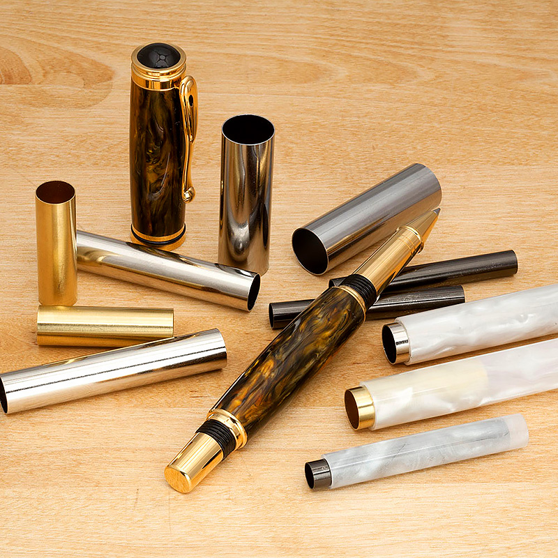 A selection of plated brass tubes and pen parts.