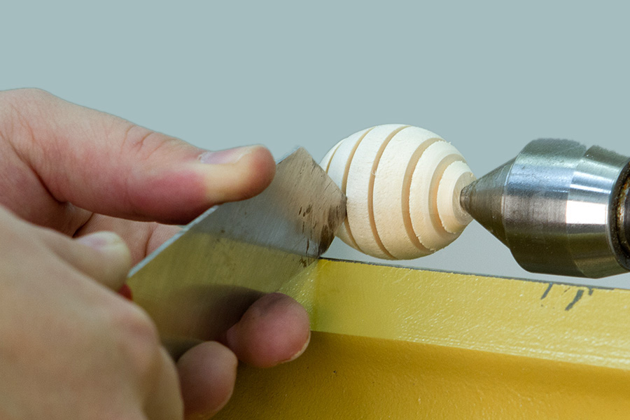 Cutting grooves with a narrow parting tool.