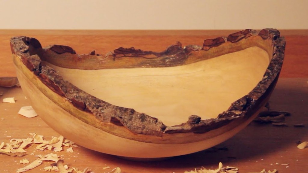 A natural edge bowl displayed on a table.