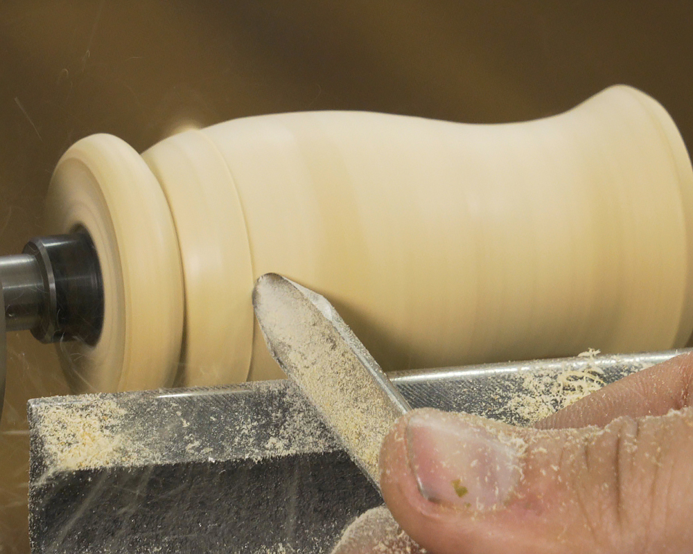 Turning the game call to shape with a spindle gouge.