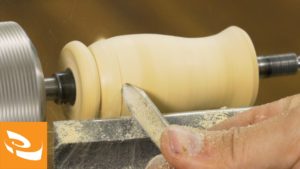 Turning a blank to shape with a spindle gouge.