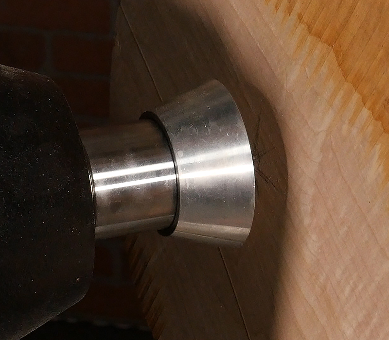 Attaching a blank to a screw center chuck.
