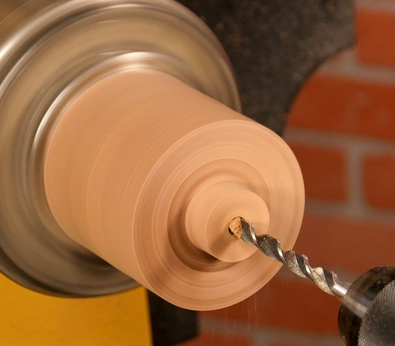 Drilling a hole in the blank with a standard drill bit.