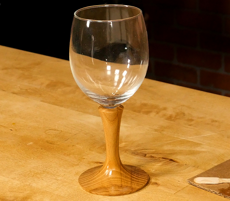 The finished wine glass displayed on a table.