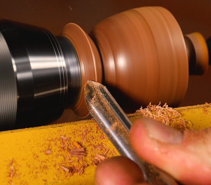 Adding detail with a spindle gouge.