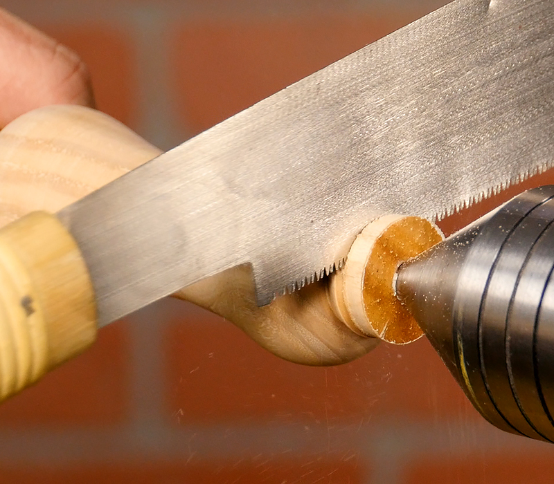 Cutting off the ends with a hand saw.