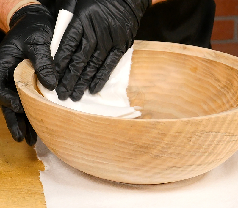 Wiping bowl with clean paper towel.