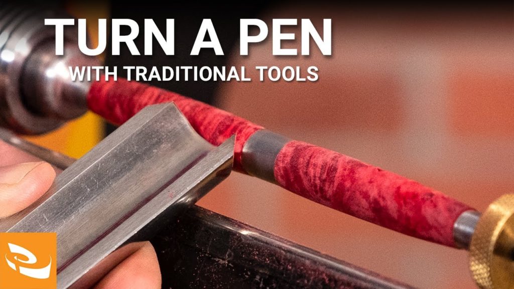 Turning a pen blank to shape with a spindle roughing gouge.