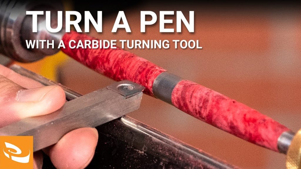 Turing a pen with a carbide insert tool.