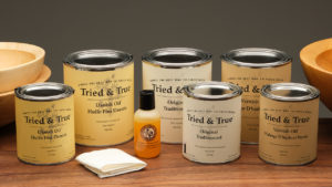 Cans of Tried and True finishes arranged on a table.