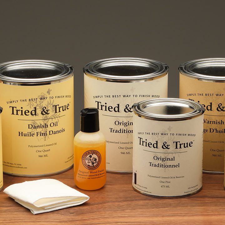 Cans of Tried and True finishes arranged on a table.